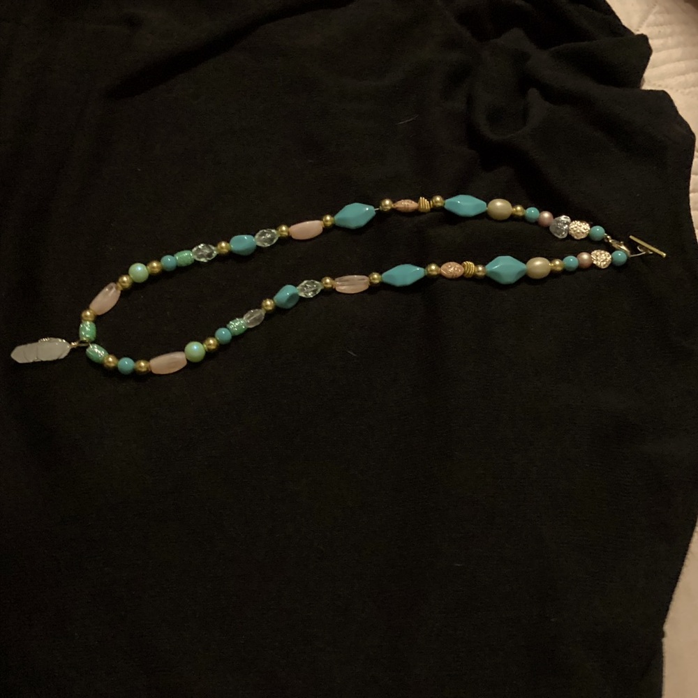 Handmade luxury beaded necklace with frosted quartz pendant. ￼